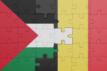 puzzle with the colourful national flag of belgium and flag of palestine.