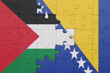 puzzle with the colourful national flag of bosnia and herzegovina and flag of palestine.