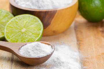 Baking soda and lime on a wooden surface