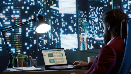 Rich executive director admiring skyscraper view at night, working after hours to improve company...