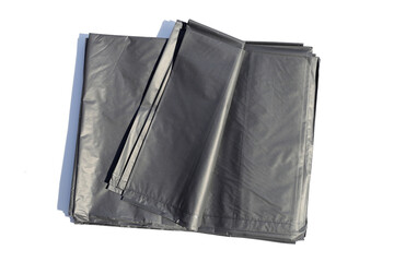 Black garbage bags on white backgrond.