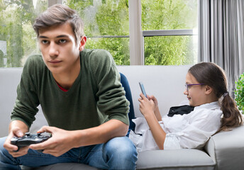 Two teenagers relaxing, engaged in digital activities