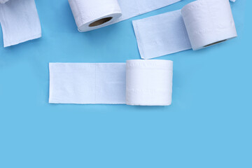 Toilet paper on blue background.