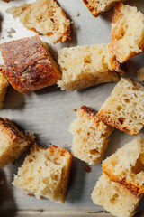 making croutons with cubes of stale sourdough bread 