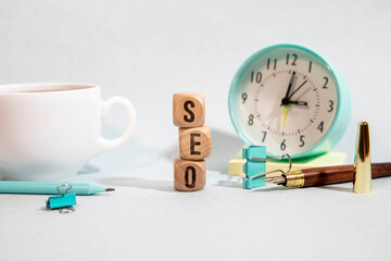 SEO - Search Engine Optimization symbol. Wooden blocks with words SEO.