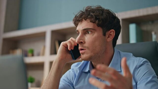 Angry entrepreneur communicating smartphone closeup. Nervous man shouting call