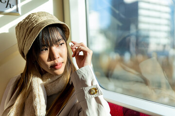 Young Asian woman enjoy outdoor lifestyle travel city by railroad transportation on holiday...