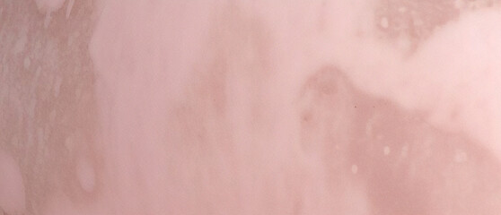 Fototapeta premium A painted old grunge with cracks and scratches, Stained blurry pink grunge texture, pink ink effect pink watercolor background, pink background for wallpaper, weeding card, and design.