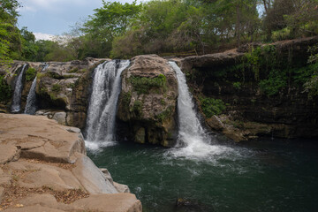 Salto de Malacatiupan - thermal water waterfall in El Salvador, in addition to its scenic beauty of a natural terrain where the Agua Caliente River meets the San Antonio River. 