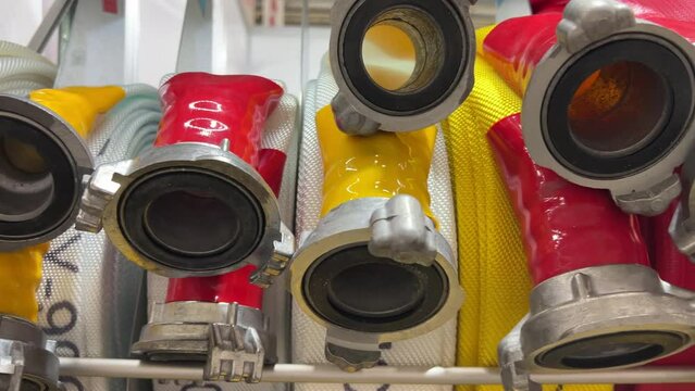 Vibrant Fire Hose Nozzles: A Close-Up Look at Crucial Firefighting Gear at Station or Exhibition