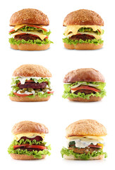 Different delicious vegetarian burgers isolated on white, set
