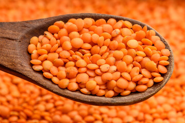 Red lentils and wooden spoon