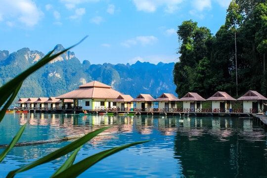 Floating Bungalows with long tail boats at Khao Sok National Park, Thailand