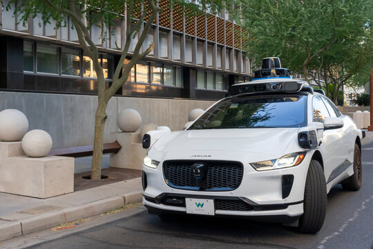 Phoenix, Arizona, USA - May 25, 2023: A Waymo&rsquo;s self-driving Jaguar electric car on the road. Phoenix, Arizona, USA. 