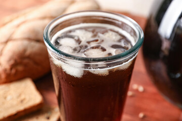 Glass of tasty kvass with ice, closeup