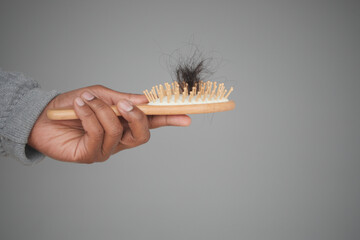 Naklejka premium man hold his list hair close up 