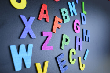 colorful letter alphabet on black background, object for education