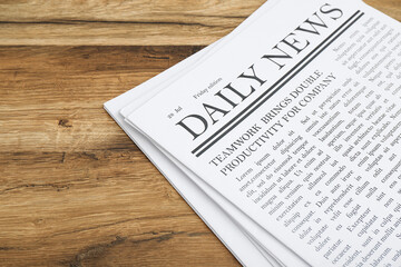 Newspapers on wooden background