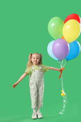 Happy little girl with colorful balloons on green background