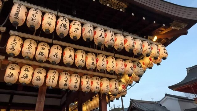 Hanging Lanterns At Yasaka Shrine Stage At Night In Gion District of Kyoto, Japan.  - wide shot