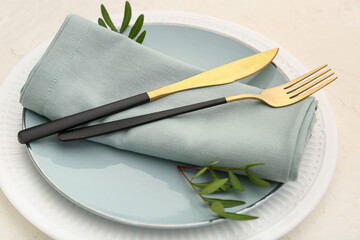 Beautiful table setting with leaves on light background