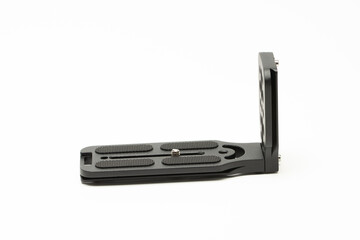 DSLR mirrorless camera L bracket. Also known as L plate. Used for quick switching between vertical and horizontal shooting on tripod. Selective focus.