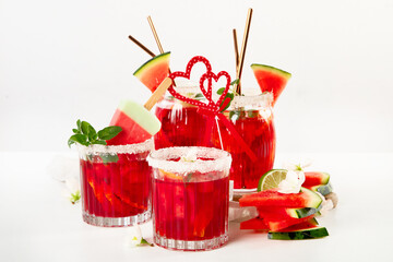 Watermelon drink in glasses with slices of watermelon.