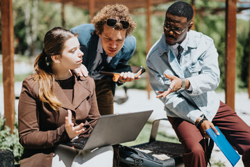 Three business professionals in an informal outdoor meeting, deeply engaged in discussing project...