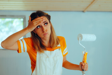 Stressed Woman Having to Paint her Home by Herself. Unhappy lady finding it difficult to renovate...