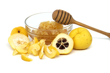 Ripe Japanese quince fruits and honey on white