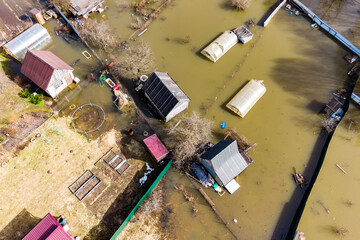 Aerial view of summer cottages during rising river levels in spring