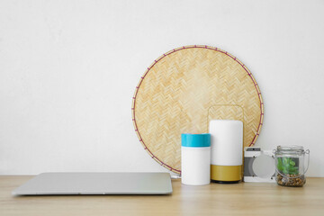 Air humidifier with laptop and lamp on shelf in room