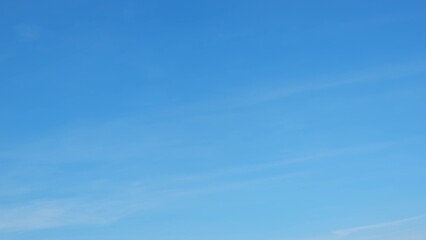 A vast, clear blue sky with no visible clouds. The blue hues are vibrant and even, creating a calm and tranquil atmosphere. The simplicity and clarity of the sky evoke a sense of openness and peace.
