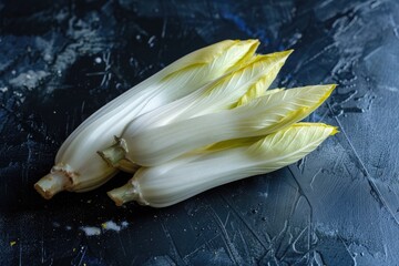 Fresh chicory on dark surface