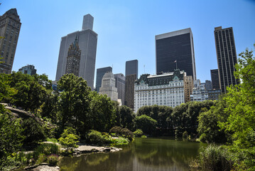 The Plaza Hotel and other Iconic Skyscrapers seen from The Pond at Central Park - Manhattan, New York City