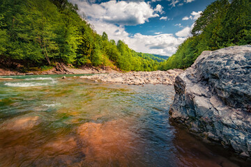 Impressive summer scene of clear waters of Prut River. Marvelous summer scene of Carpathian...