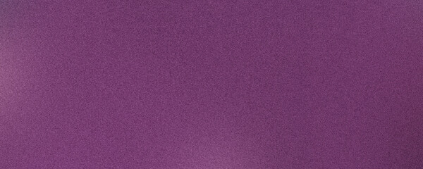 Fototapeta premium Vibrant purple background with a subtle grain texture, suitable for design use