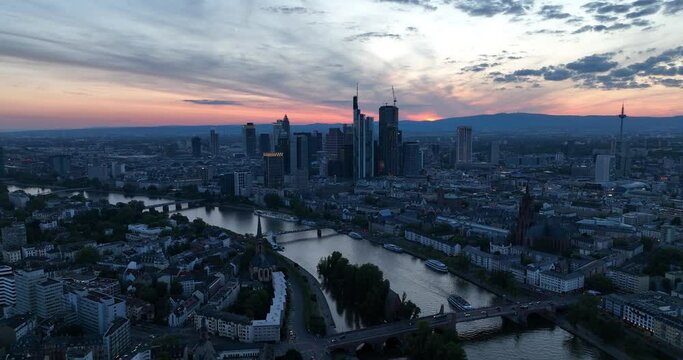 The rhine river in Frank furt am Main, City skyline of the financial district at dusk.