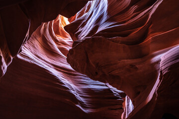 Upper Antelope Canyon, near Page, Arizona, is a breathtaking slot canyon known for its narrow passageways and vibrant sandstone walls.