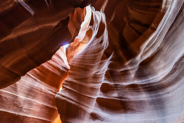 Upper Antelope Canyon, near Page, Arizona, is a breathtaking slot canyon known for its narrow passageways and vibrant sandstone walls.