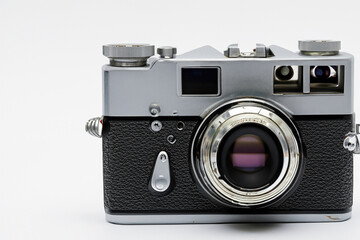Retro film photo camera isolated on white background