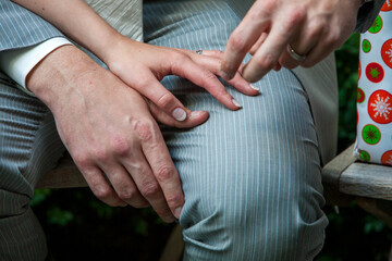 A couple lovingly exchanges rings in a heartfelt moment, symbolizing deep commitment and affection...