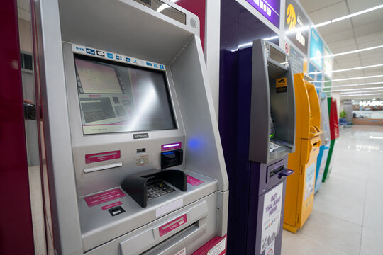 BANGKOK, THAILAND - OCTOBER 14, 2023: assortment of automated teller machines as seen in Don Mueang International Airport.