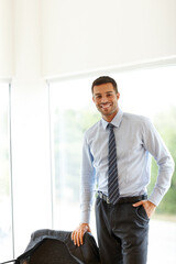 Portrait, smile and business man in office for career, job and working at corporate company in Italy. Happy professional, entrepreneur and confident salesman at workplace, employee or expert worker