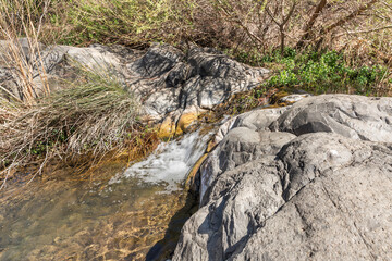 Small  waterfall on the Zavitan stream flows into the Yehudia National Natural Park in northern Israel