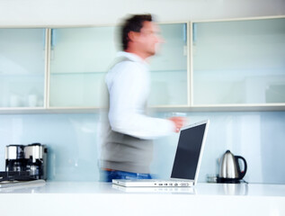 Kitchen, blur and walking man with laptop, professional and speed with technology, creative agency and entrepreneur. Person, employee and graphic designer with computer, deadline and morning rush