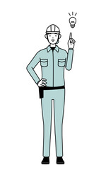 Female engineer in helmet and work wear coming up with an idea.