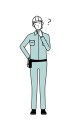 Female engineer in helmet and work wear nodding her head in question.