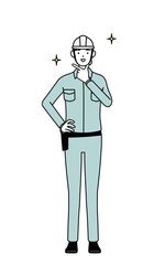 Female engineer in helmet and work wear in a confident pose.