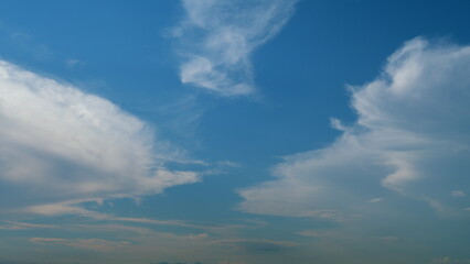 Cirrostratus clouds flying slowly on beautiful blue sky horizon background. Timelapse.